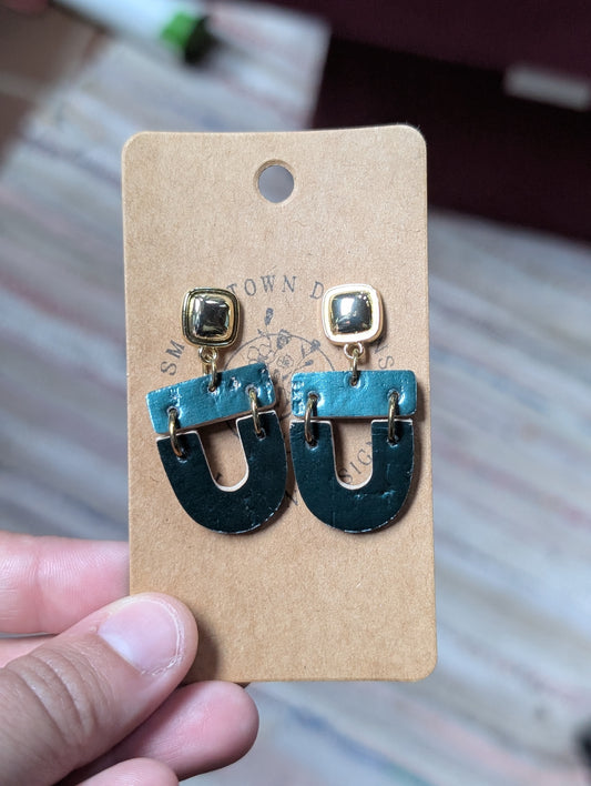 Metallic green dangles